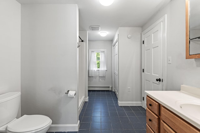 319 Harris Rd, Cumberland, ME 04021 - bathroom with baseboards, a baseboard heating unit, vanity, toilet, and tile patterned floors
