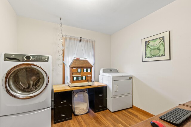 18 Grant St, Sanford, ME 04083 - clothes washing area with baseboards, laundry area, washing machine and dryer, and light wood-type flooring