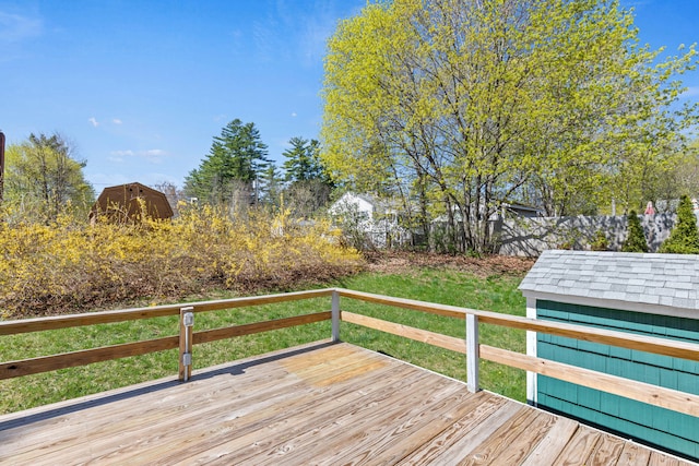 18 Grant St, Sanford, ME 04083 - deck with a storage unit and an outbuilding
