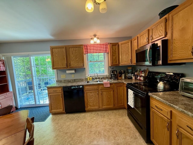 47 Taylor Ln, Naples, ME 04055 - kitchen featuring black appliances, a sink, brown cabinets, a chandelier, and light tile patterned flooring