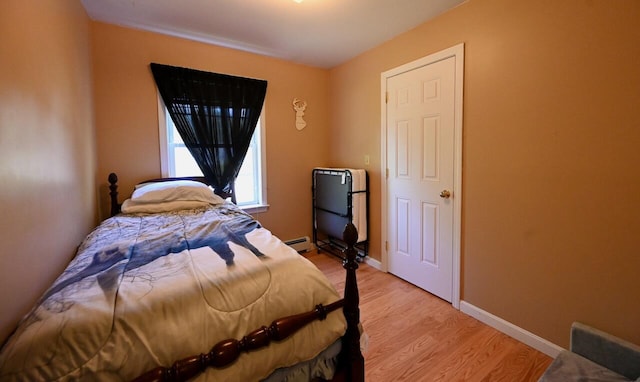 47 Taylor Ln, Naples, ME 04055 - bedroom featuring light wood-type flooring, a baseboard heating unit, and baseboards