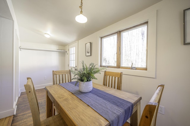 dining area featuring baseboards and wood finished floors