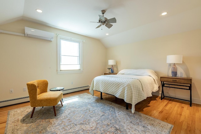 bedroom with a wall mounted AC, baseboard heating, lofted ceiling, and light wood-type flooring