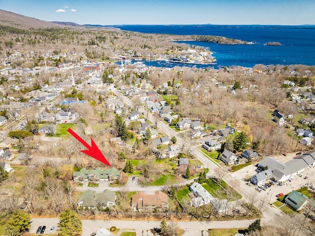 drone / aerial view with a water view and a residential view