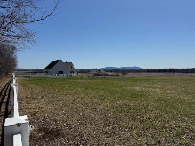 129 Williams Rd, Presque Isle, ME 04769 - view of yard featuring a mountain view, a rural view, and fence