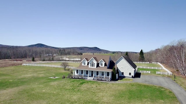 129 Williams Rd, Presque Isle, ME 04769 - exterior space featuring covered porch, a front yard, and a mountain view