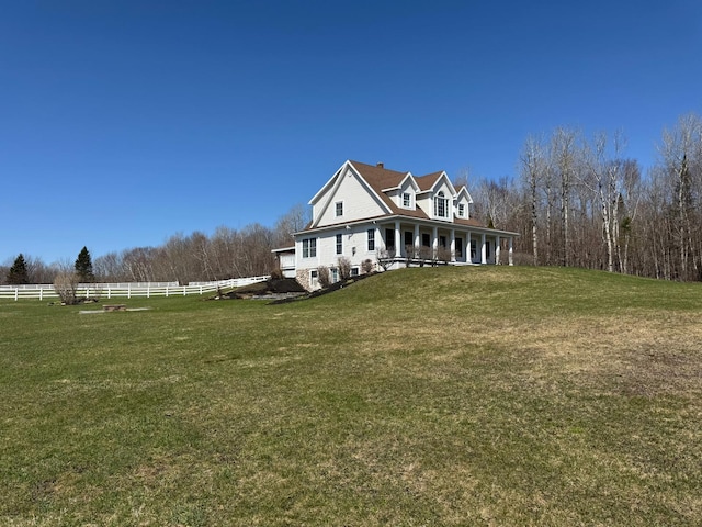 129 Williams Rd, Presque Isle, ME 04769 - view of home's exterior featuring fence, a chimney, a yard, and a porch