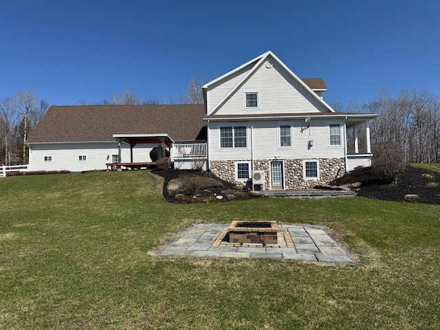 129 Williams Rd, Presque Isle, ME 04769 - back of house with a yard, stone siding, a patio area, and an outdoor fire pit