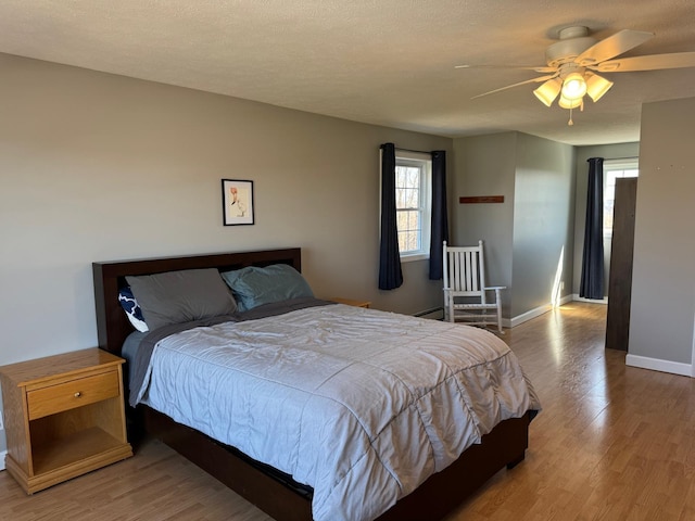 129 Williams Rd, Presque Isle, ME 04769 - bedroom featuring wood finished floors, baseboards, and multiple windows