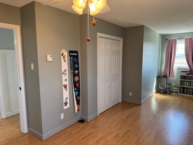 129 Williams Rd, Presque Isle, ME 04769 - interior space featuring baseboards, a ceiling fan, a closet, and light wood finished floors