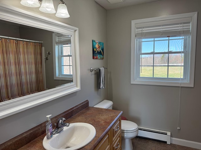 129 Williams Rd, Presque Isle, ME 04769 - full bath with a shower with curtain, baseboard heating, toilet, tile patterned floors, and vanity
