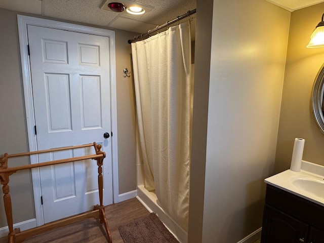 129 Williams Rd, Presque Isle, ME 04769 - full bathroom featuring baseboards, wood finished floors, a shower with curtain, and vanity