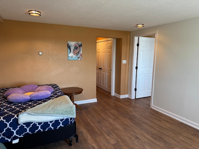 129 Williams Rd, Presque Isle, ME 04769 - bedroom with a textured ceiling, wood finished floors, a closet, and baseboards