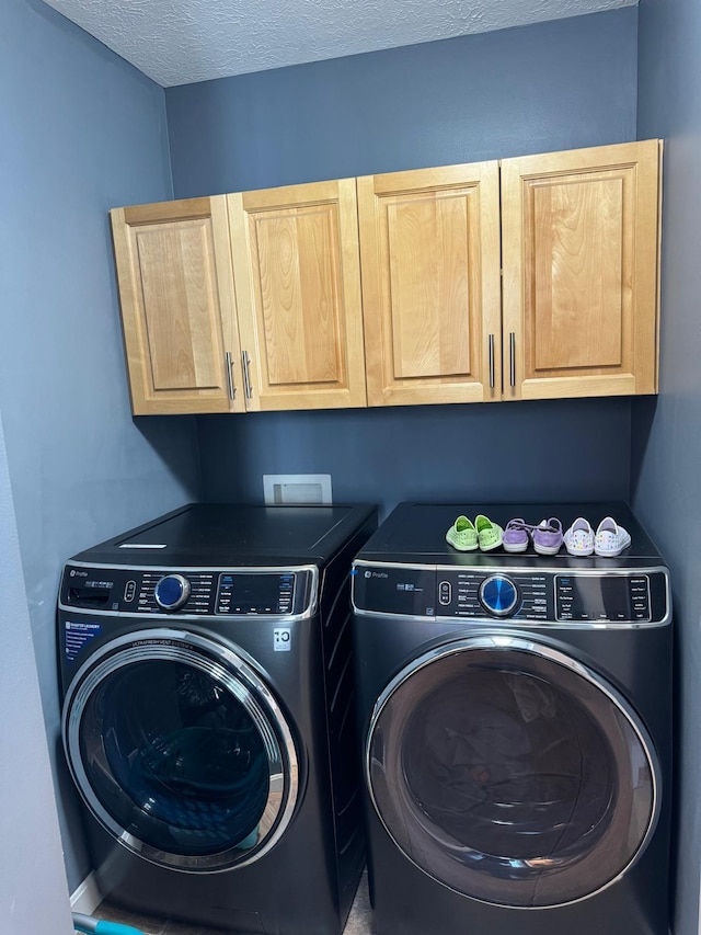 129 Williams Rd, Presque Isle, ME 04769 - laundry area featuring cabinet space, a textured ceiling, and washing machine and dryer