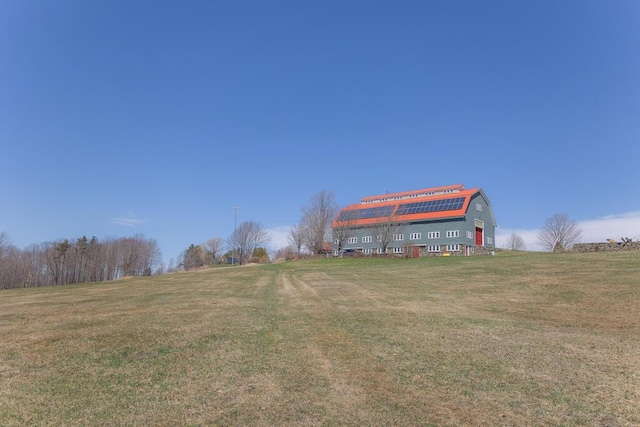view of property's community with a lawn