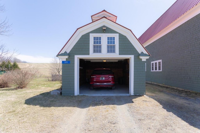 detached garage featuring driveway