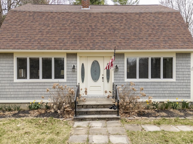 42 Ledge Hill Rd, Raymond, ME 04071 - view of front facade with roof with shingles and a chimney