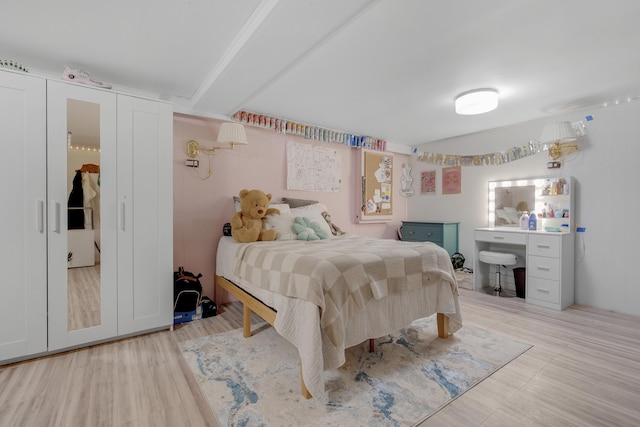 42 Ledge Hill Rd, Raymond, ME 04071 - bedroom with beamed ceiling and wood finished floors