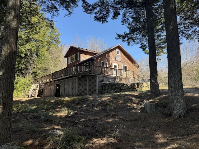 172 Alder Brook Ln, Waltham, ME 04605 - rear view of house featuring a deck and stairway