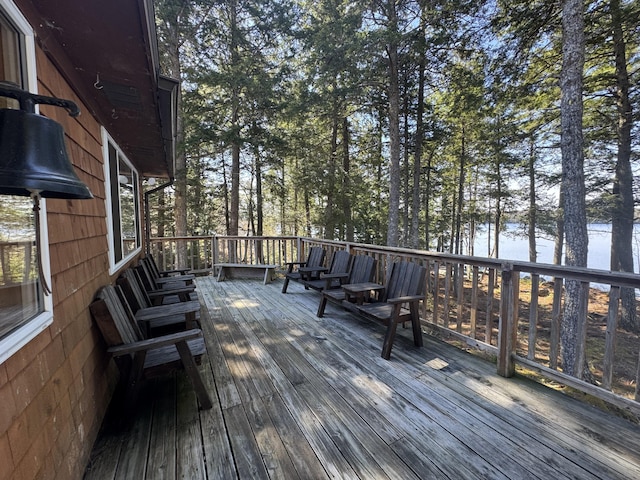 172 Alder Brook Ln, Waltham, ME 04605 - wooden deck with a water view and view of scattered trees