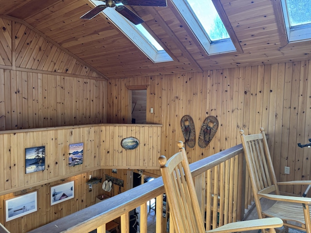 172 Alder Brook Ln, Waltham, ME 04605 - corridor with an upstairs landing, a skylight, wooden ceiling, vaulted ceiling, and wooden walls