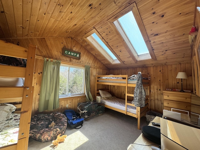 172 Alder Brook Ln, Waltham, ME 04605 - carpeted bedroom featuring vaulted ceiling, a skylight, wood walls, and wood ceiling