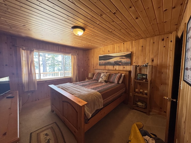 172 Alder Brook Ln, Waltham, ME 04605 - carpeted bedroom featuring wood walls and wooden ceiling