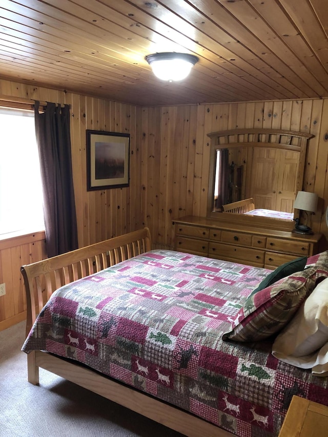 172 Alder Brook Ln, Waltham, ME 04605 - bedroom featuring wood walls, wood ceiling, and carpet