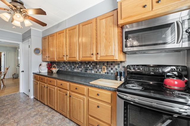 kitchen with stainless steel microwave, electric range oven, ornamental molding, a ceiling fan, and backsplash