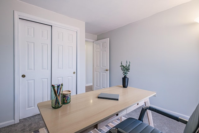 office featuring baseboards and dark carpet