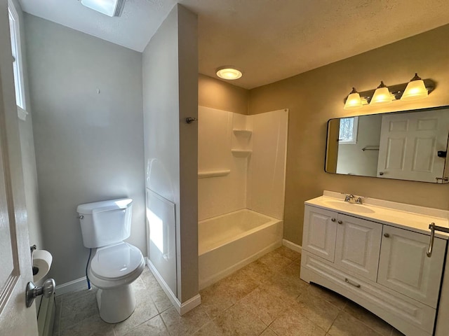 full bath with shower / bathing tub combination, vanity, tile patterned floors, baseboards, and toilet