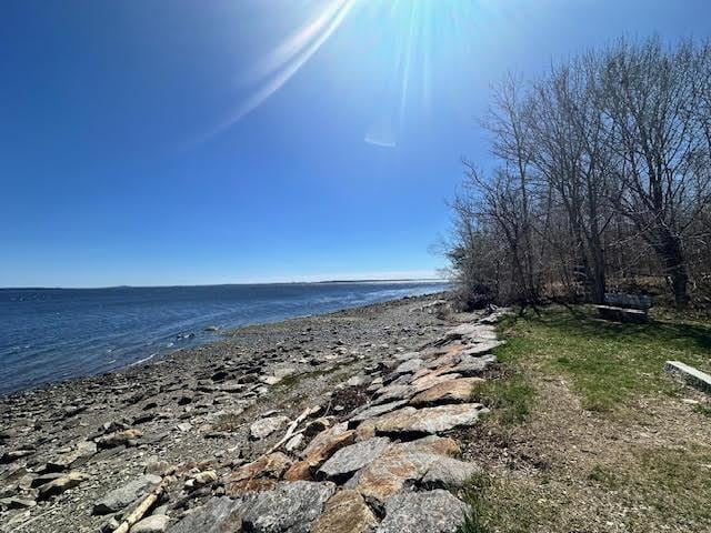 property view of water featuring a beach view