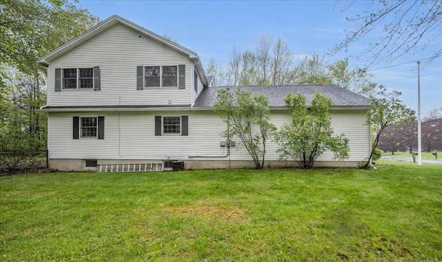 17 Fenton Way, Bangor, ME 04401 - rear view of house with cooling unit and a shingled roof