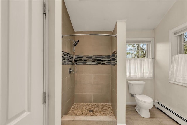 17 Fenton Way, Bangor, ME 04401 - full bathroom featuring a baseboard radiator, toilet, and a tile shower