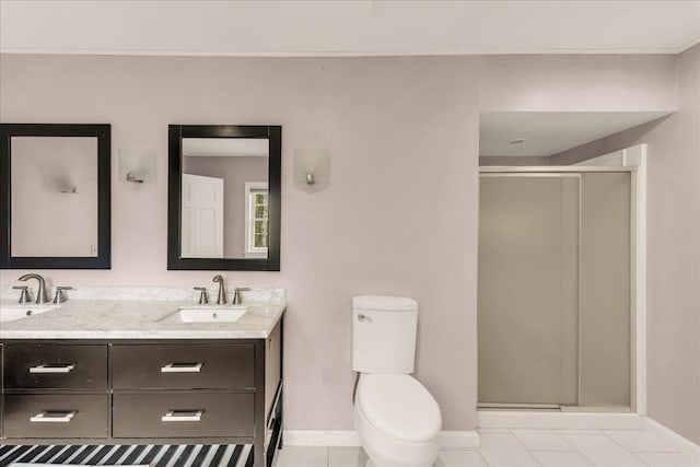 17 Fenton Way, Bangor, ME 04401 - bathroom featuring baseboards, double vanity, a shower stall, and toilet