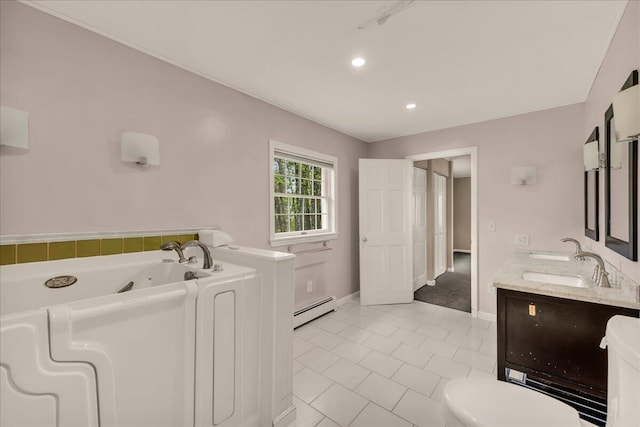 17 Fenton Way, Bangor, ME 04401 - bathroom featuring a baseboard radiator, a tub with jets, double vanity, toilet, and tile patterned flooring