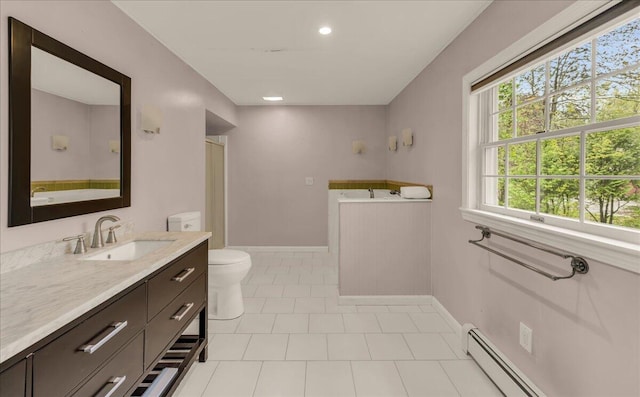 17 Fenton Way, Bangor, ME 04401 - bathroom with tile patterned floors, toilet, vanity, a baseboard radiator, and a bath