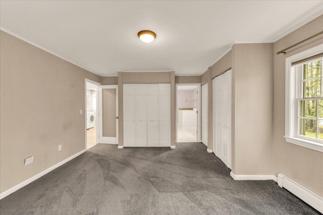 17 Fenton Way, Bangor, ME 04401 - unfurnished bedroom with baseboard heating, two closets, ornamental molding, washer / clothes dryer, and carpet floors