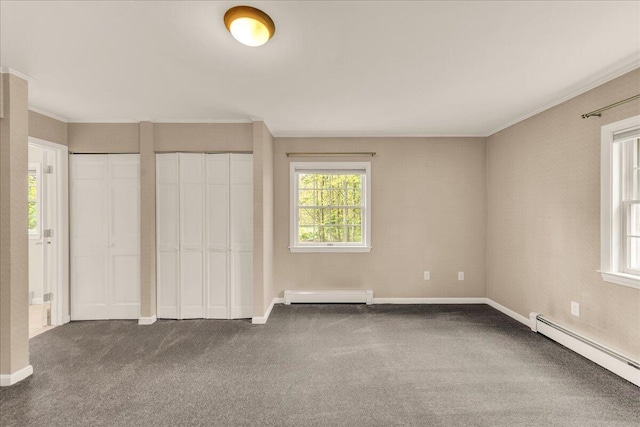 17 Fenton Way, Bangor, ME 04401 - unfurnished bedroom with a baseboard heating unit, a baseboard radiator, multiple windows, dark colored carpet, and crown molding