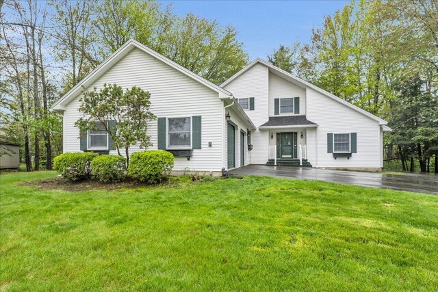 17 Fenton Way, Bangor, ME 04401 - view of front facade with an attached garage and a front yard