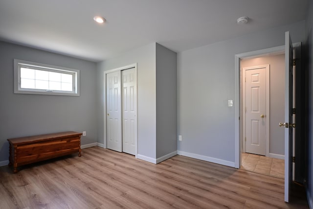 25 Ireland Dr, Berwick, ME 03901 - unfurnished bedroom with light wood finished floors, baseboards, a closet, and recessed lighting