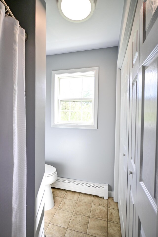 25 Ireland Dr, Berwick, ME 03901 - bathroom with baseboard heating, toilet, baseboards, and tile patterned flooring