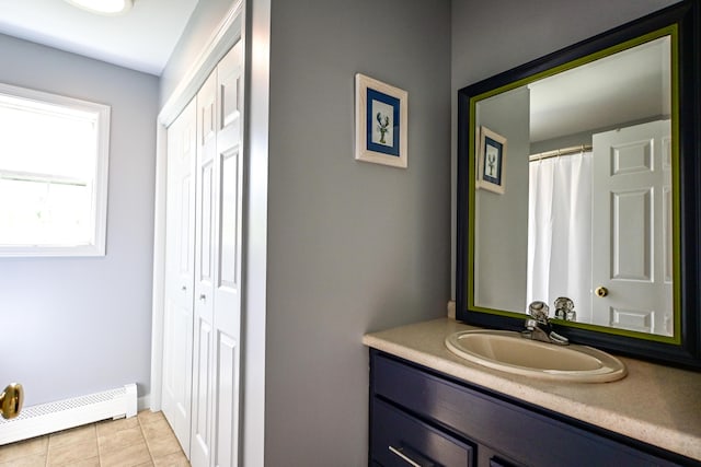 25 Ireland Dr, Berwick, ME 03901 - full bathroom with a baseboard heating unit, vanity, tile patterned floors, and baseboards