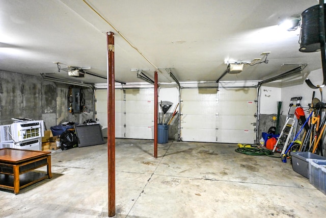 25 Ireland Dr, Berwick, ME 03901 - garage featuring a garage door opener and a central vacuum unit