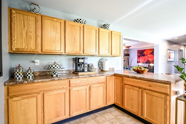 25 Ireland Dr, Berwick, ME 03901 - kitchen with a peninsula, light brown cabinets, light tile patterned floors, and dark stone countertops