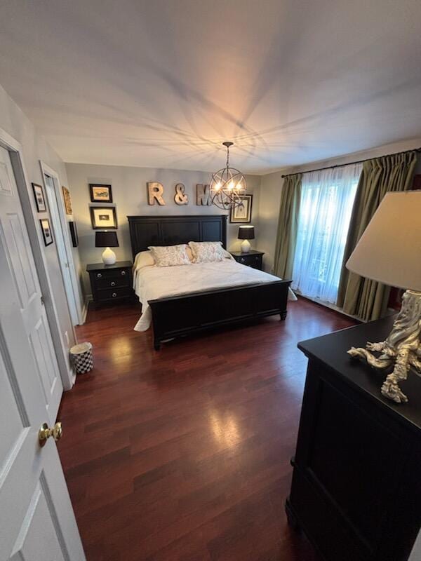 25 Ireland Dr, Berwick, ME 03901 - bedroom with dark wood-style floors and a chandelier