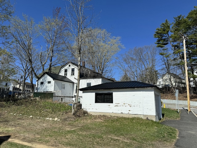 view of side of property with metal roof