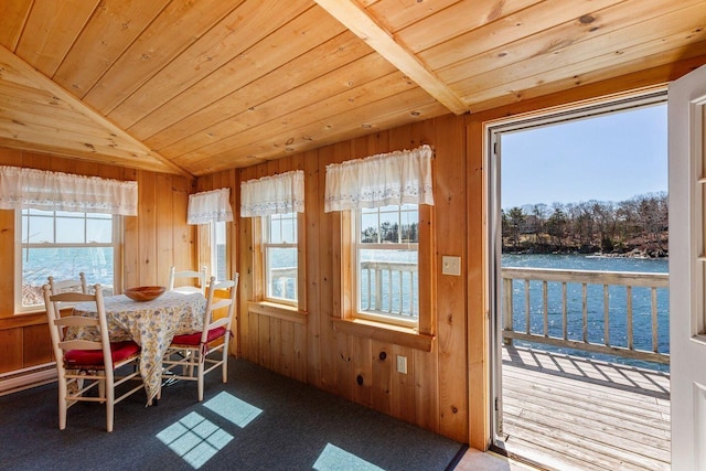 147 State Route 32, Bristol, ME 04554 - carpeted dining space featuring lofted ceiling, wood walls, wood ceiling, healthy amount of natural light, and a water view