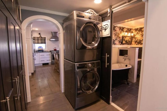 60 St John Rd, Fort Kent, ME 04743 - washroom with stacked washer / drying machine, arched walkways, and crown molding