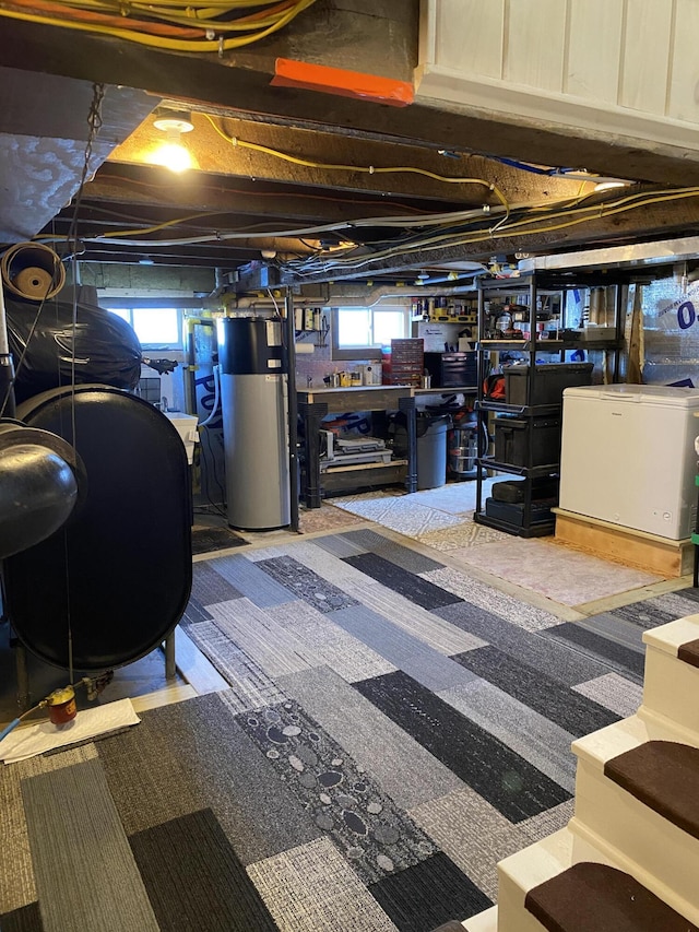 60 St John Rd, Fort Kent, ME 04743 - below grade area with water heater, heating fuel, plenty of natural light, and refrigerator